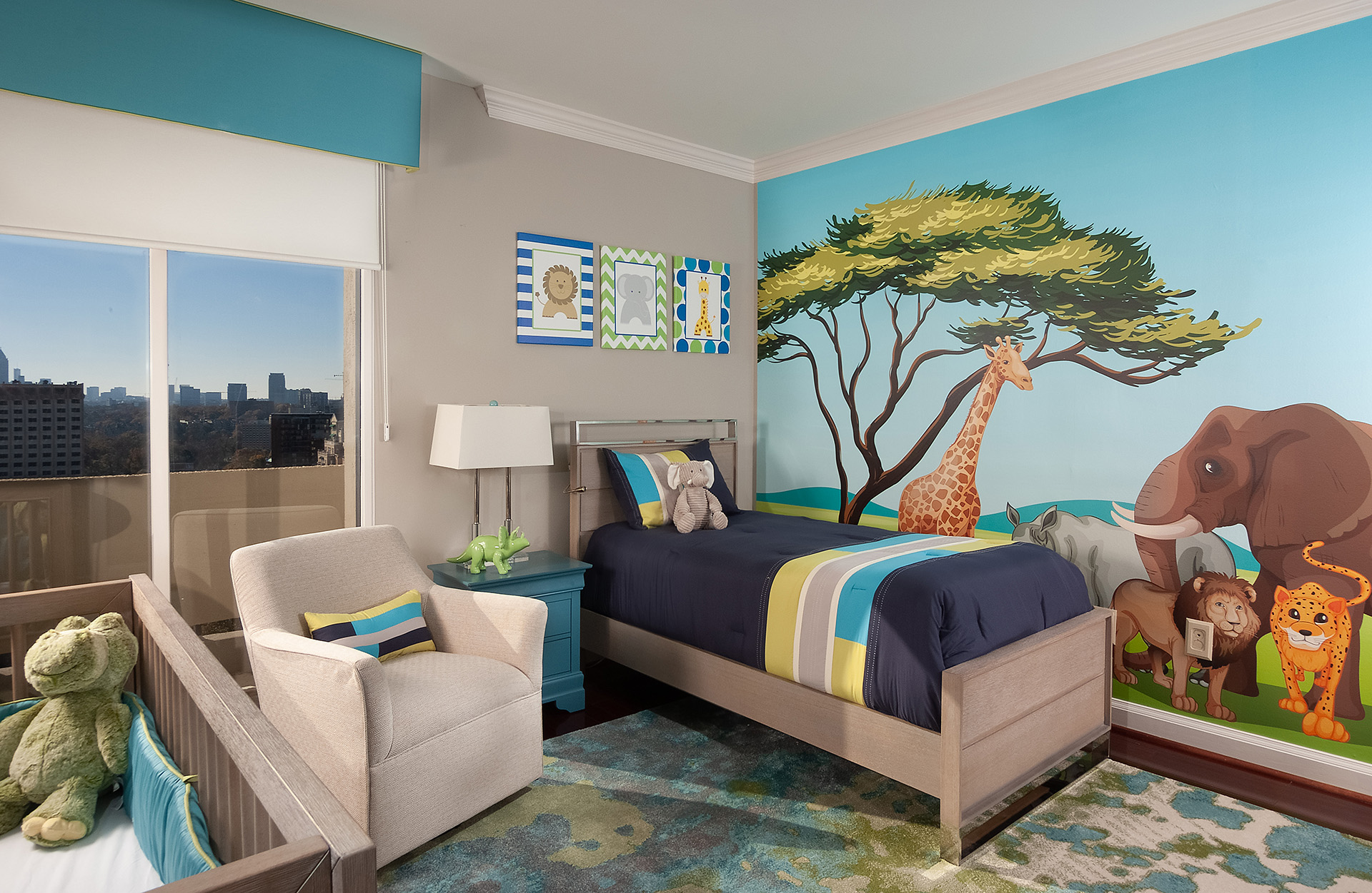 A photo of a colorful and playful children's room with an accent wall, wallart, and a vibrant area rug.